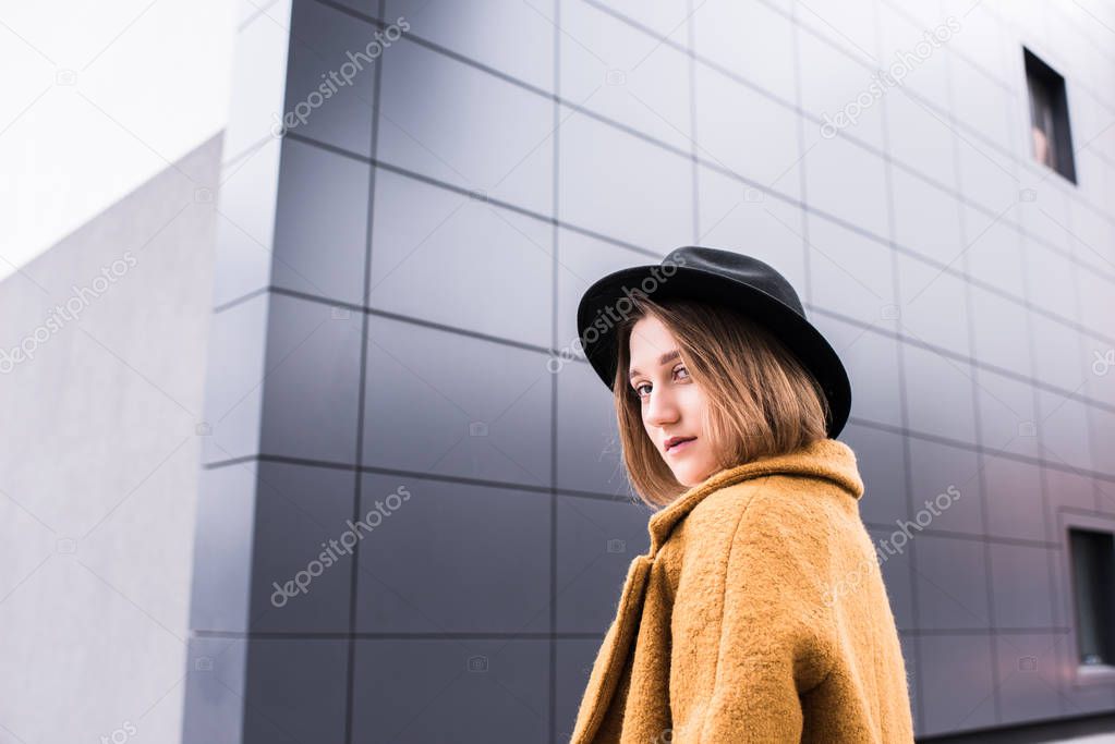 fashionable young woman in hat
