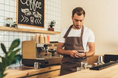 barista with smartphone clipart