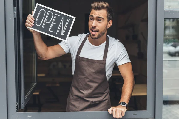 Waiter holding chalkboard with open word — Stock Photo, Image