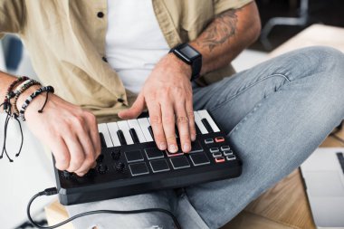 modern dj working with MPC pad clipart