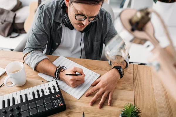 Musician writing notes — Stock Photo, Image