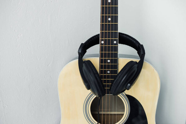 acoustic guitar and headphones
