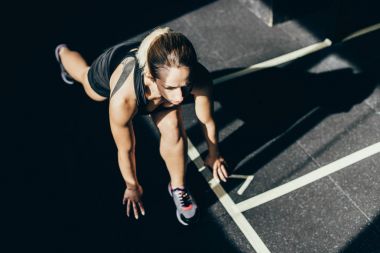 sportswoman in starting stance clipart