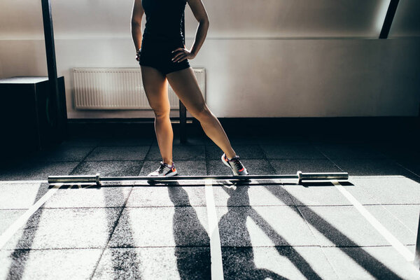 sportswoman with barbell