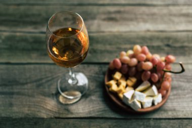glass of white wine and grapes with cheese clipart