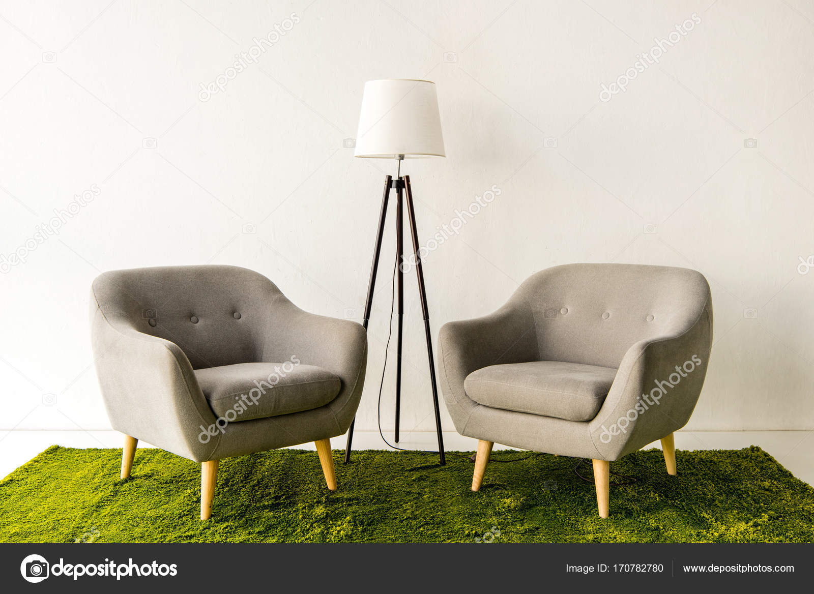 Armchairs and lamp on green carpet Stock Photo by ©YBoychenko 170782780