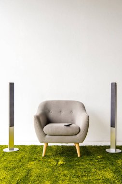 Armchair with remote controller and loudspeakers  clipart