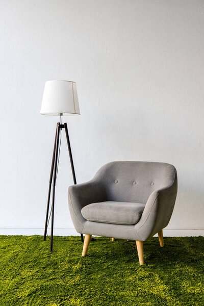 Gray armchair and lamp