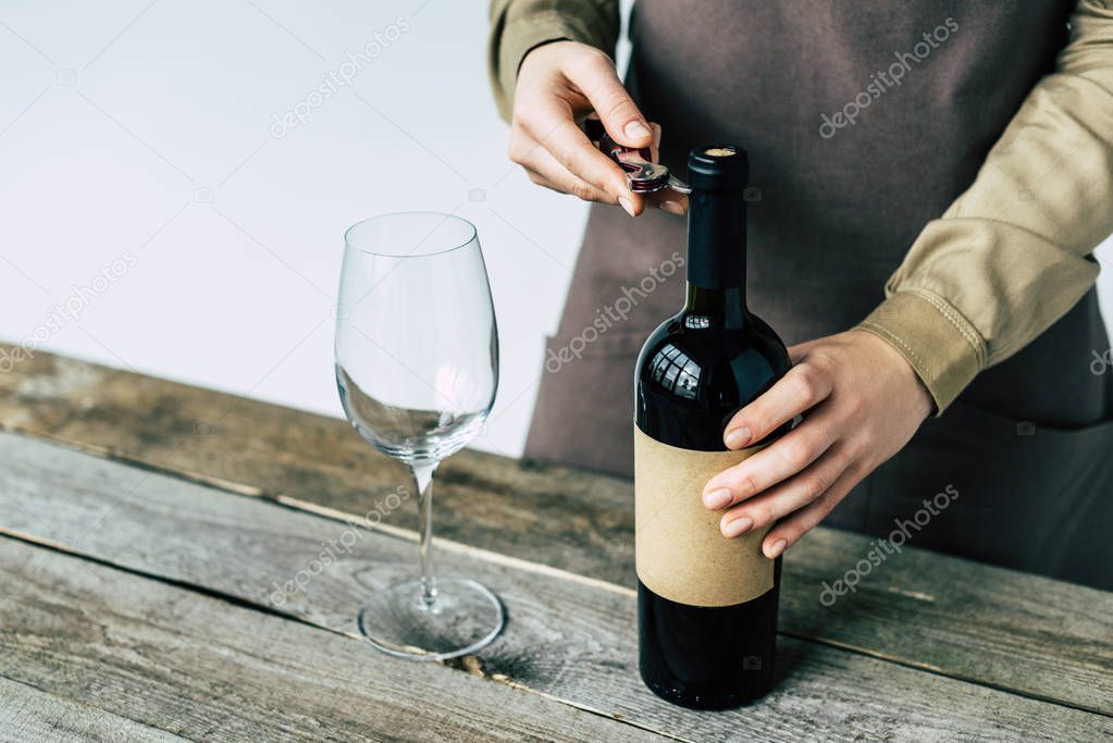 Sommelier opening bottle of wine 
