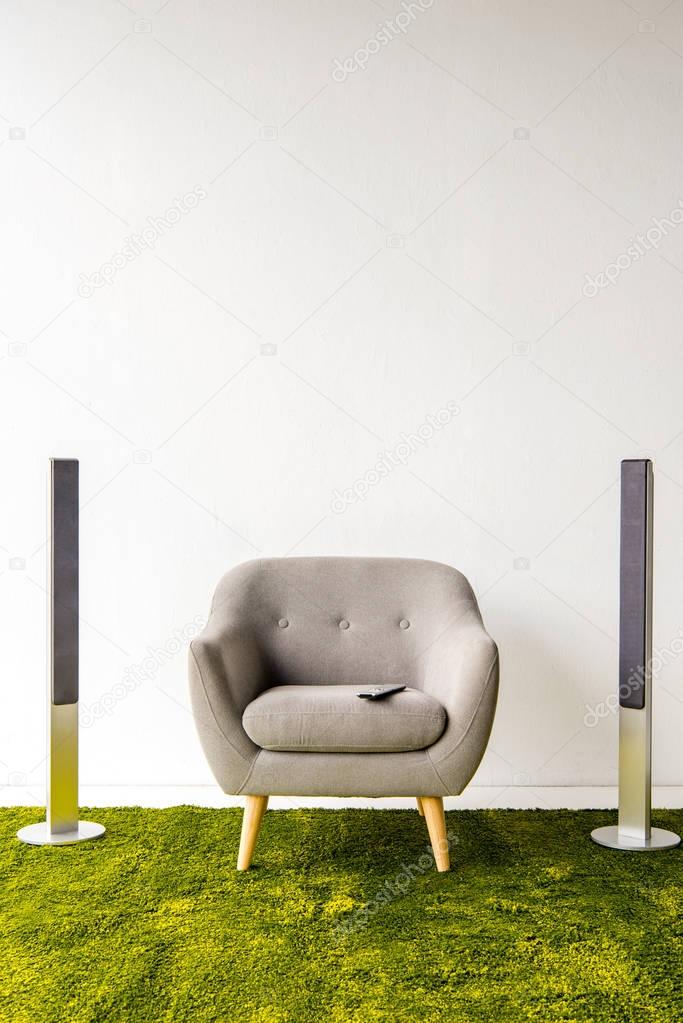 Armchair with remote controller and loudspeakers 