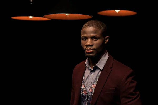 African american man with lamps — Free Stock Photo