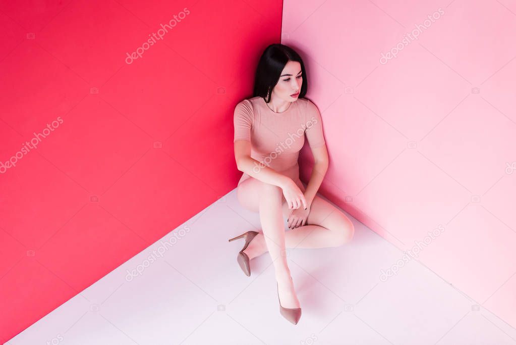 girl in bodysuit and high heeled shoes