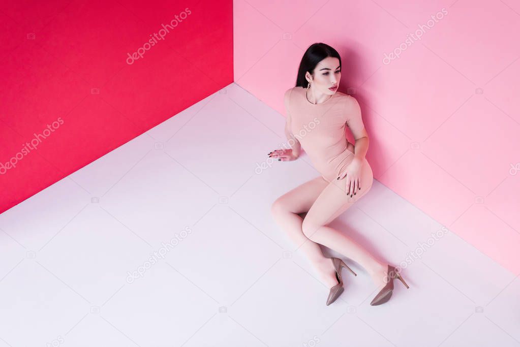 girl in bodysuit and high heeled shoes