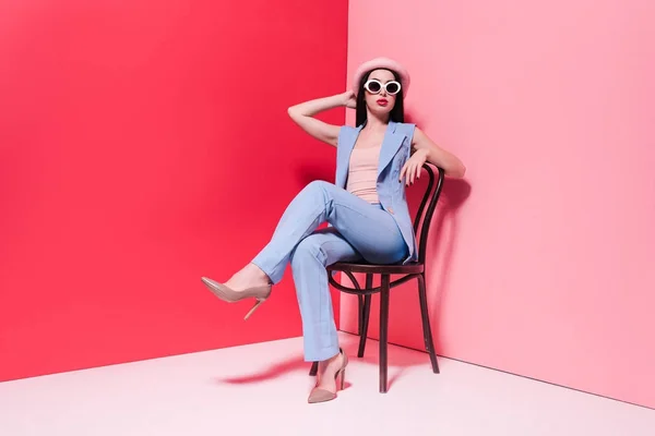 Fashionable girl sitting on chair — Stock Photo, Image