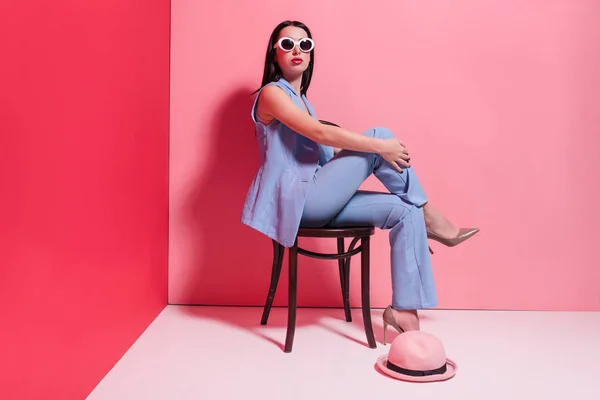 Fashionable girl sitting on chair — Stock Photo, Image