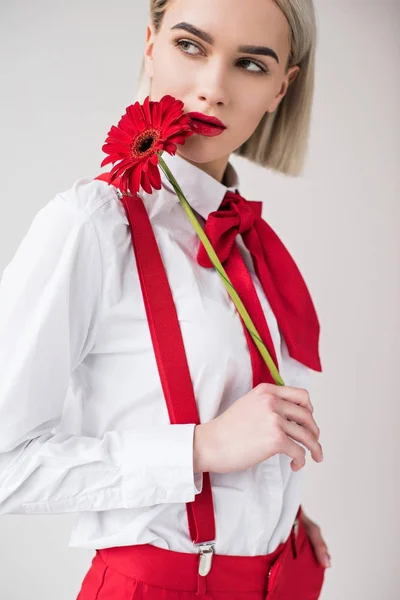 Attractive girl with red flower — Stock Photo, Image