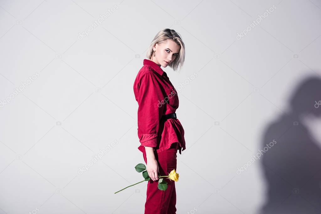 elegant girl in red clothes with rose
