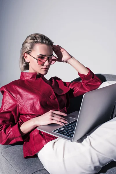 Stylish girl using laptop — Stock Photo, Image