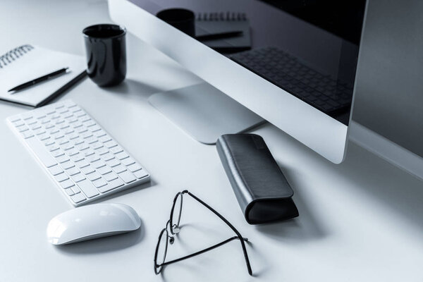 glasses and spectacle case on working table