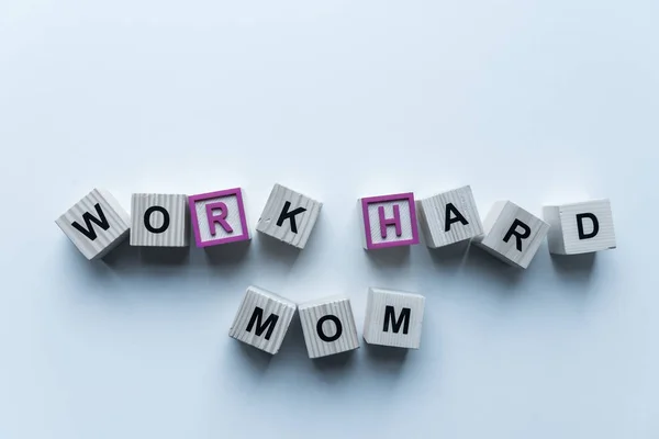 Top View Wooden Cubes Words Work Hard Mom Blue Table — Free Stock Photo