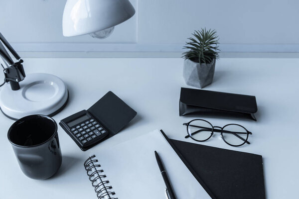 working place with table lamp and plant