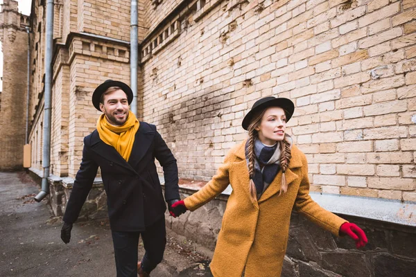 Cute Young Couple Holding Hands Running Old Building — Stock Photo, Image