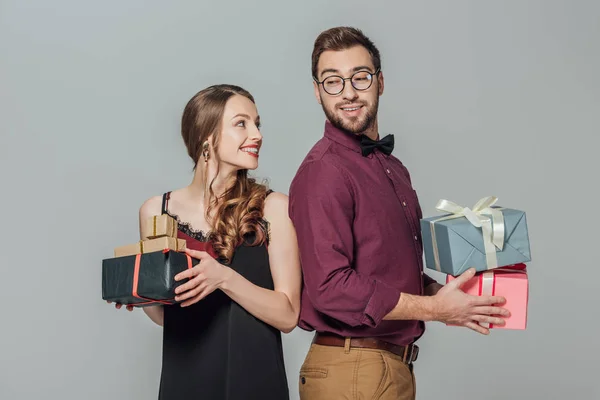 Happy Stylish Young Couple Holding Gift Boxes Smiling Each Other — Stock Photo, Image
