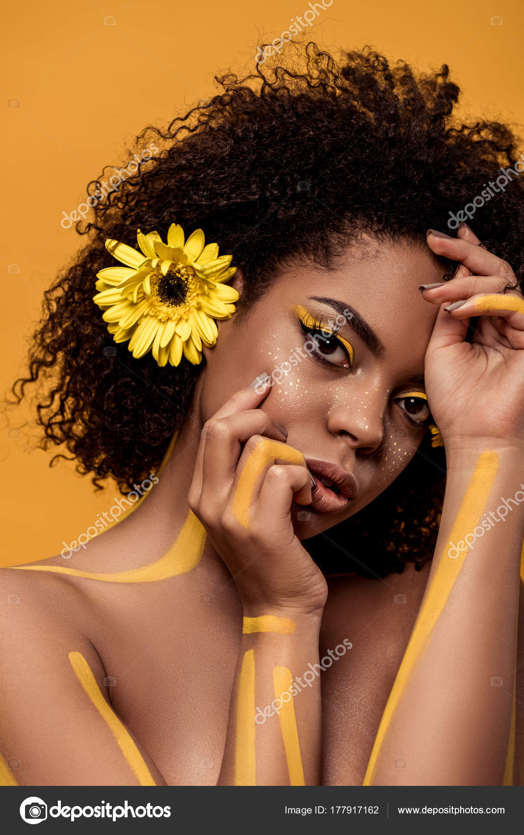 Beautiful African American Woman Artistic Make Gerbera Hair Hands Face  Stock Photo by ©Y-Boychenko 177917162