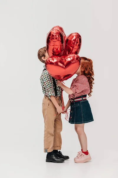 Side View Beautiful Little Couple Standing Heart Shaped Balloons Isolated — Stock Photo, Image