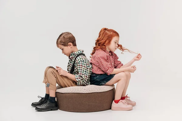 Children Sitting Back Back While Boy Using Digital Tablet Isolated — Stock Photo, Image