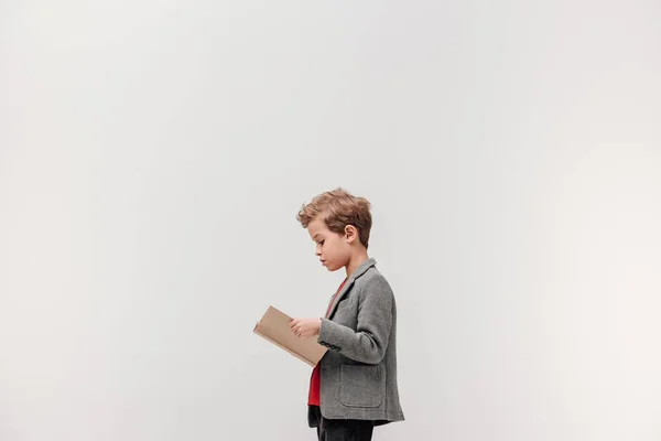 Side View Stylish Little Schoolboy Reading Book Isolated Grey — Stock Photo, Image