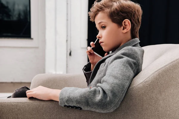 Stylish Little Boy Sitting Armchair Talking Phone — Stock Photo, Image