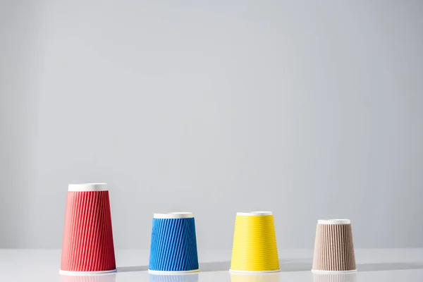 Various Colorful Paper Cups Row Grey — Stock Photo, Image