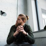 Bottom view of businessman sitting and looking up