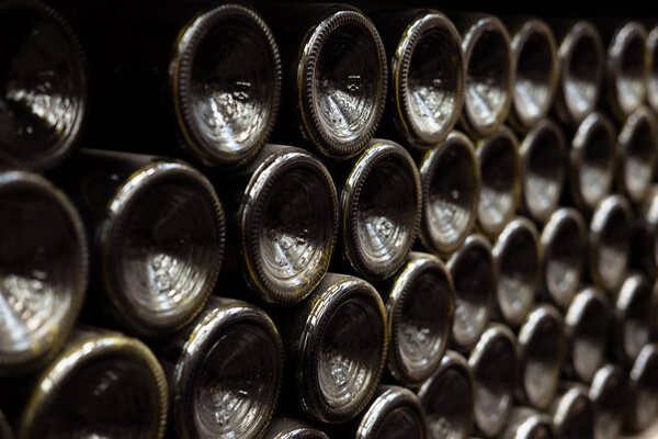 close up view of wall made of wine bottles