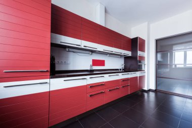 view of empty modern kitchen in red color clipart