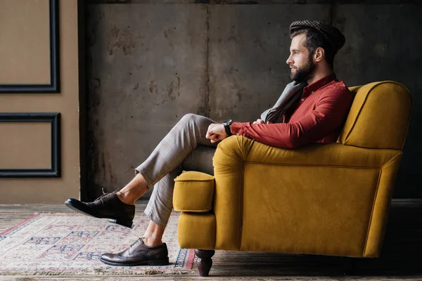 Fashionable Bearded Man Sitting Yellow Sofa — Stock Photo, Image