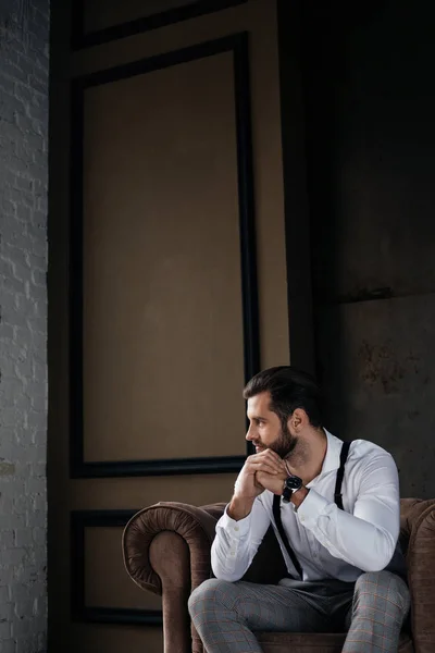 Handsome Thoughtful Man Sitting Armchair — Free Stock Photo