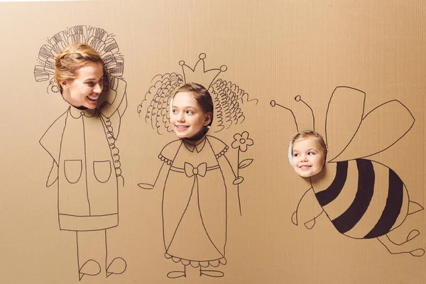 Partial View Smiling Mother Daughters Heads Cardboard Paper Pictures — Stock Photo, Image