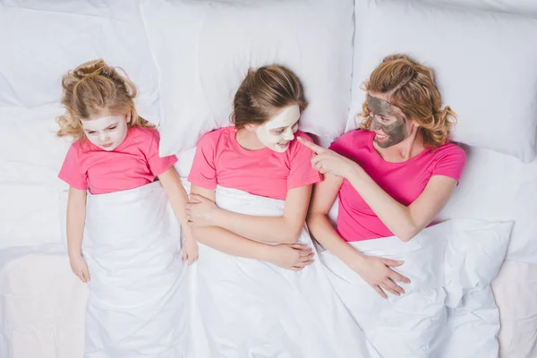 Top View Happy Mother Daughters Lying Bed Together Skincare Masks — Stock Photo, Image