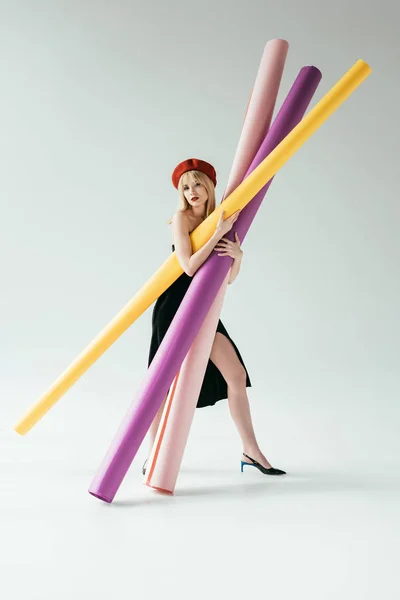 Stylish Pretty Woman Black Dress Carrying Colorful Paper Rolls — Stock Photo, Image