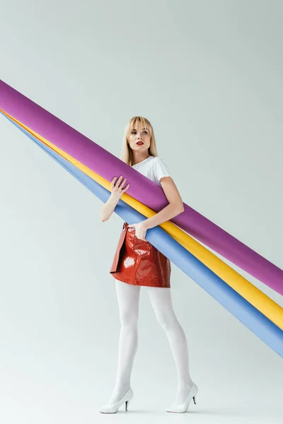 Attractive Young Woman Carrying Colorful Paper Rolls — Stock Photo, Image