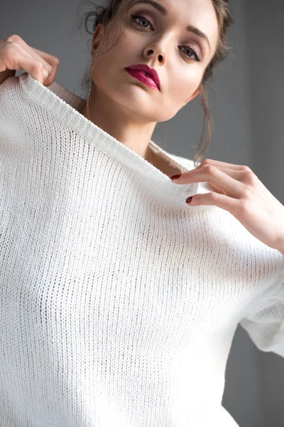 Seductive Brunette Girl Taking White Sweater Looking Camera Grey — Stock Photo, Image