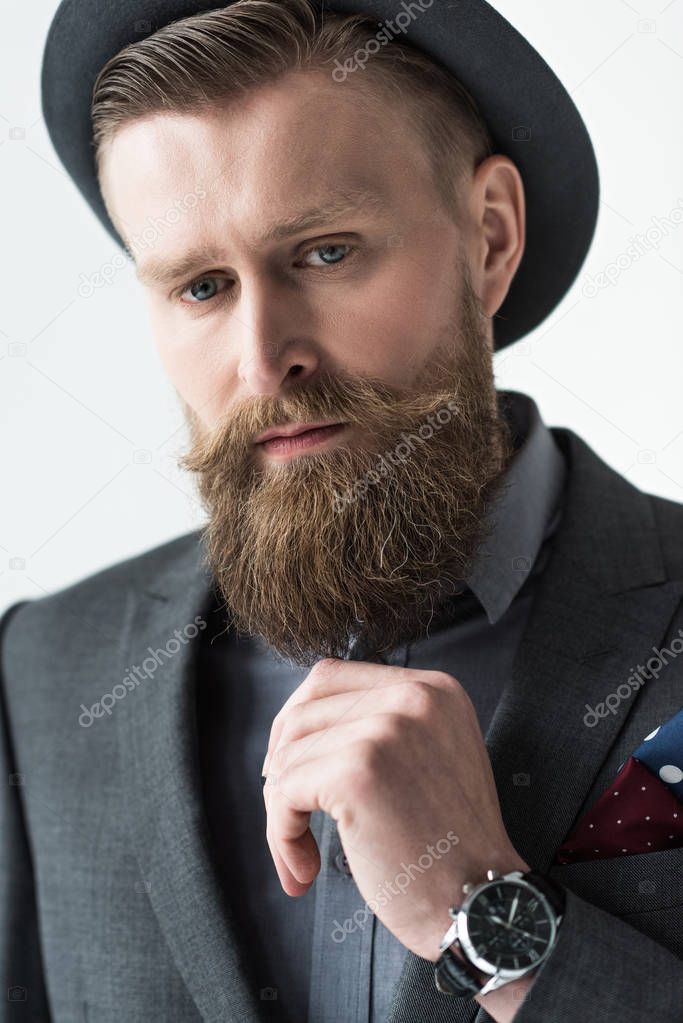 Man with vintage mustache and beard isolated on light background