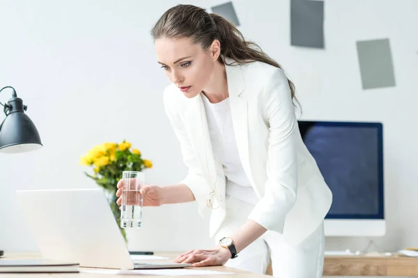 Focused Businesswoman Glass Water Using Laptop Workplace Office — Stock Photo, Image
