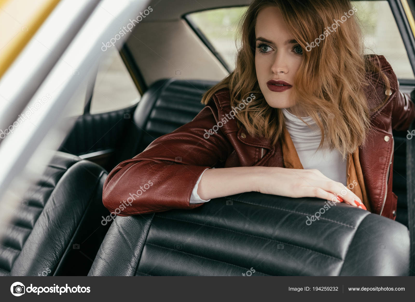 Beautiful Young Woman Leather Jacket Sitting Classic Car Looking Beautiful Young Woman In Leather Jacket Sitting Classic Car And Looking Away Photo By