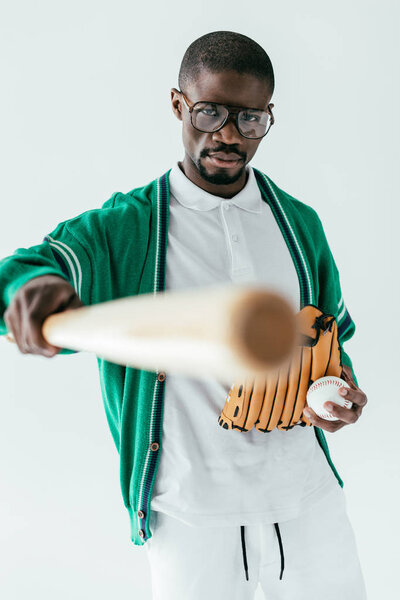 selective focus of african american baseball player with baseball bat, isolated on white