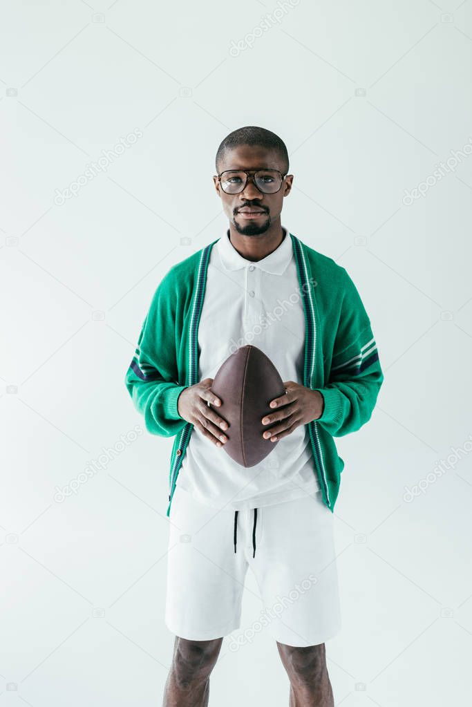 fashionable african american rugby player with ball, isolated on white