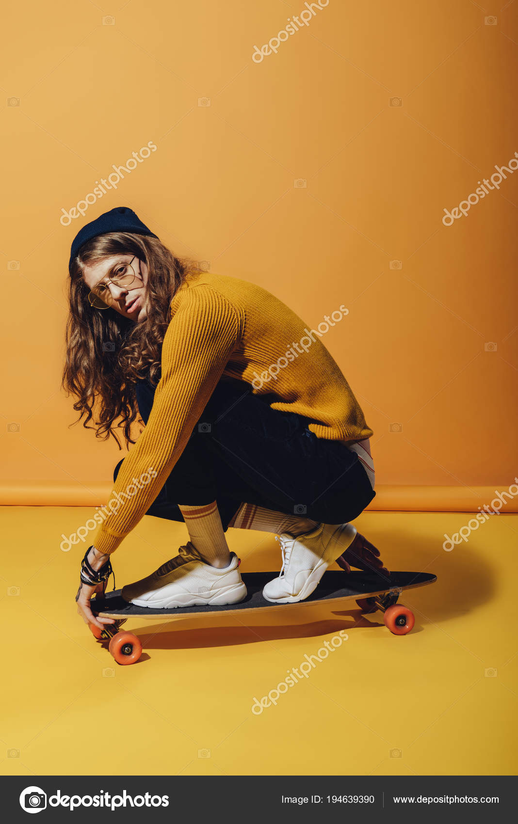 Skateboarder Long Hair Sitting Longboard Yellow Stock Photo ©Y-Boychenko 194639390