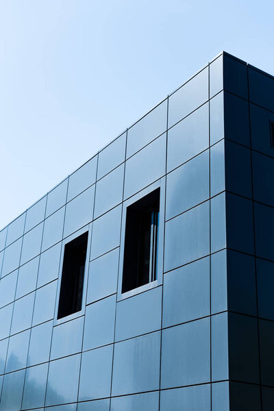 Modern glass building on sky background